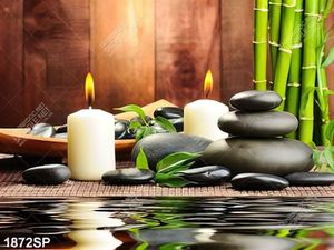 Tranh spa ngọn nến và viên đá đen